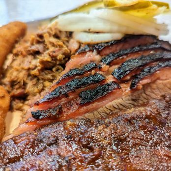 The Original Q Shack - Close-up of Chili-Rubbed Beef Brisket, sliced. Part of our Three Meat Combo. $22.95. - Barbeque Near Me - Durham, North Carolina The Original Q Shack - Close-up of Chili-Rubbed Beef Brisket, sliced. Part of our Three Meat Combo. $22.95. - Barbeque Near Me - Durham, North Carolina
