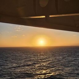 A sunrise taken off the verandah while at sea.