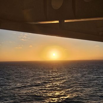 Disney Cruise Line - A sunrise taken off the verandah while at sea. - Transportation Near Me