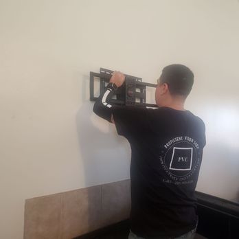 Xpress TV Installation  - Gary was placing the wall mount into position. - TV Mounting Near Me