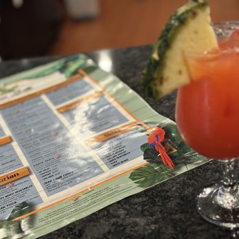 Cutlass Grille - a drink and menu on a table - Caribbean Near Me - Chesapeake, Virginia Cutlass Grille - a drink and menu on a table - Caribbean Near Me - Chesapeake, Virginia