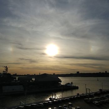 Manhattan Cruise Terminal - This is a shot of the setting sun while in port on the ship. Photo taken October 21, 2017. - Transportation Near Me - New York, New York Manhattan Cruise Terminal - This is a shot of the setting sun while in port on the ship. Photo taken October 21, 2017. - Transportation Near Me - New York, New York