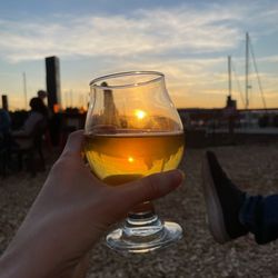 Sunset from the outdoor seating area with a delicious hard cider from the tap
