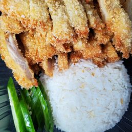 Chicken katsu with curry sauce on the side. Chicken katsu with curry sauce on the side.