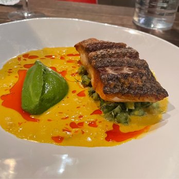S.K.Y. - Crispy bass on top of green chickpeas - New American Near Me - Chicago, Illinois