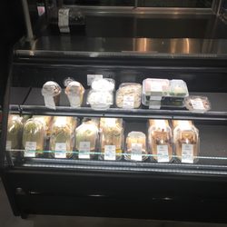 Refrigerator with sandwich wraps, pudding parfaits, salads, hummus & veggies
