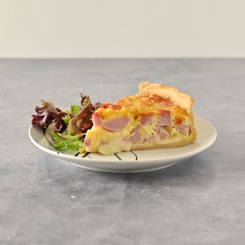 Anywhere Bistro - a slice of ham and cheese quiche on a plate - Coffee & Tea Near Me - Sunny Isles Beach, Florida Anywhere Bistro - a slice of ham and cheese quiche on a plate - Coffee & Tea Near Me - Sunny Isles Beach, Florida