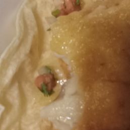 Supposed to have been a fish taco. Not clear if it was broken in half or what was done but it looked like someone had a nice healthy bite ou Supposed to have been a fish taco. Not clear if it was broken in half or what was done but it looked like someone had a nice healthy bite ou