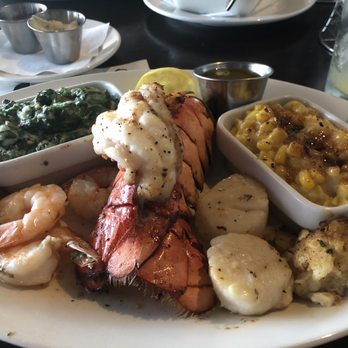 Ray's On the River - Broiled Seafood Platter with creamed spinach and creamed Corn Creme Brulee. - Seafood Near Me - Sandy Springs, Georgia Ray's On the River - Broiled Seafood Platter with creamed spinach and creamed Corn Creme Brulee. - Seafood Near Me - Sandy Springs, Georgia