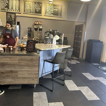 Whispering Bean Coffee Roasters - two people in a coffee shop - Coffee Roasteries Near Me - Albuquerque, New Mexico