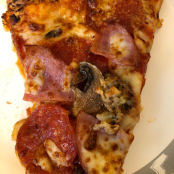 Domino's Pizza - a slice of pizza on a plate - Pizza Near Me - Battle Creek, Michigan