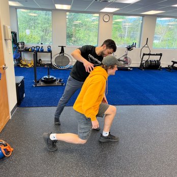 Physiopros Performance Rehab - Dr Fady assisting a patient during exercise - Physical Therapy Near Me - Parsippany, New Jersey Physiopros Performance Rehab - Dr Fady assisting a patient during exercise - Physical Therapy Near Me - Parsippany, New Jersey