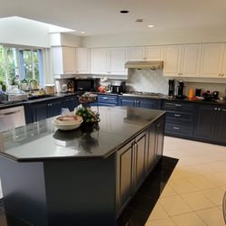 True Blue Painting & Cabinet Refinishing - Kitchen Cabinets Refinished / Painted in blue & white.