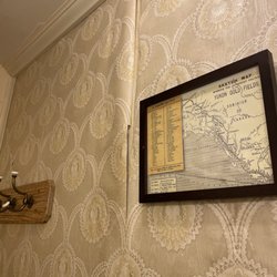 The Van Gilder Hotel - Wallpaper lifting off of the wall, present throughout the whole room