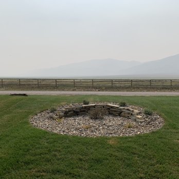 Pondside Property Services - Rock bed island with small wall cutout - Landscaping Near Me - Rigby, Idaho Pondside Property Services - Rock bed island with small wall cutout - Landscaping Near Me - Rigby, Idaho