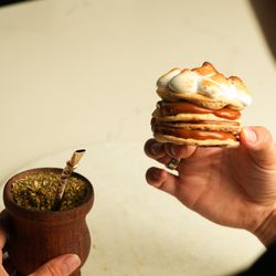 Mercado Buenos Aires - Traditional Argentine Rogel layered with dulce de leche and topped with toasted meringue, perfectly paired with mate.