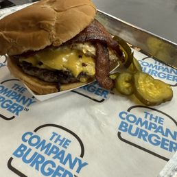 The Company Burger with bacon and a fried runny egg