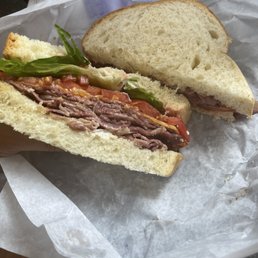 Pastrami on Challah with lettuce, tomato, and cheddar. Loved every bite!