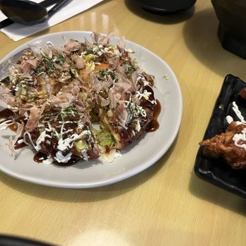 Yua Ramen - Okonomiyaki cut up with a knife. - Ramen Near Me - Edmonds, Washington Yua Ramen - Okonomiyaki cut up with a knife. - Ramen Near Me - Edmonds, Washington