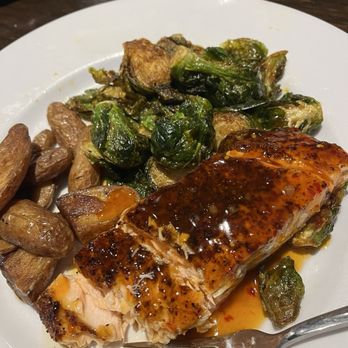 Sky Bistro Lounge - Sweet Chili Glazed Salmon with Brussels Sprouts and Fingerling Potatoes - Lounges Near Me - Columbia, South Carolina Sky Bistro Lounge - Sweet Chili Glazed Salmon with Brussels Sprouts and Fingerling Potatoes - Lounges Near Me - Columbia, South Carolina