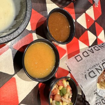 Condado Tacos - A variety of salsa and sauces -- the mango salsa is fantastic! - Tacos Near Me - Mountain Brook, Alabama