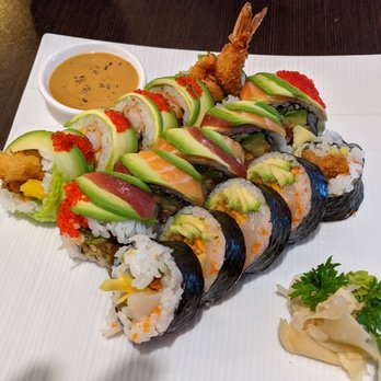 Orchid Sushi - a plate of sushi and a bowl of dipping sauce - Sushi Bars Near Me - Ottawa, Ontario Orchid Sushi - a plate of sushi and a bowl of dipping sauce - Sushi Bars Near Me - Ottawa, Ontario
