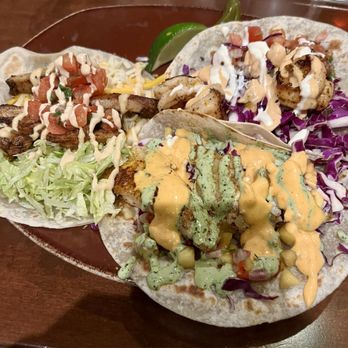 Tio Taco + Tequila Bar - Clockwise: Baja shrimp taco, grilled fish taco, Guajillo chicken taco - Tacos Near Me - Newark, Delaware Tio Taco + Tequila Bar - Clockwise: Baja shrimp taco, grilled fish taco, Guajillo chicken taco - Tacos Near Me - Newark, Delaware