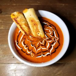 Soup There It Is - Tomato soup with grilled cheese rolls. Balsamic & cashew crema drizzle