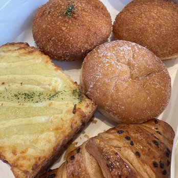 Tous Les Jours - Clockwise from left: Croque Monsieur, Kimchi croquette, Curry Croquette, red bean donut, Chocolate Hazelnut croissant - Coffee & Tea Near Me - Midvale, Utah