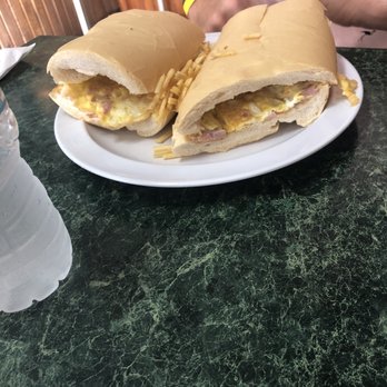 Dennys Latin Cafe - Ham, Egg, and Cheese breakfast sandwich - Cuban Near Me - Key Largo, Florida Dennys Latin Cafe - Ham, Egg, and Cheese breakfast sandwich - Cuban Near Me - Key Largo, Florida