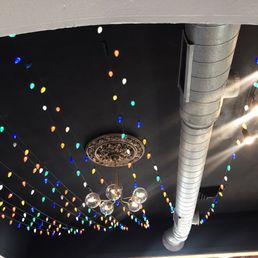 a ceiling decorated with lights a ceiling decorated with lights