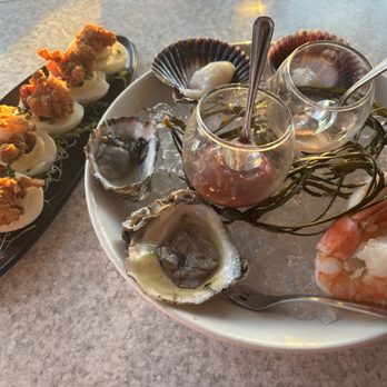 Castaway Burbank - Surf & Turf Deviled Eggs (chicken fried lobster & crispy bacon) and Seafood Tower (shrimp, oysters, & scallops). - Bars Near Me - Burbank, California Castaway Burbank - Surf & Turf Deviled Eggs (chicken fried lobster & crispy bacon) and Seafood Tower (shrimp, oysters, & scallops). - Bars Near Me - Burbank, California