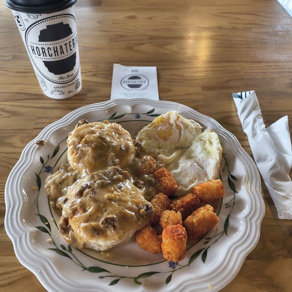 Chorizo Biscuit and Gravy potatoe tarts and 2 eggs over easy and a Horchate Steamer. Chorizo Biscuit and Gravy potatoe tarts and 2 eggs over easy and a Horchate Steamer.