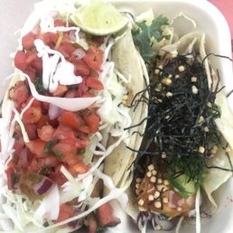 Fish taco on the left and tuna taco on the right. Fish taco on the left and tuna taco on the right.