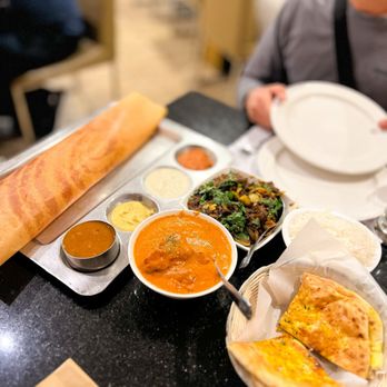 8Elements Perfect Indian Cuisine - a woman sitting at a table - Indian Near Me - San Jose, California 8Elements Perfect Indian Cuisine - a woman sitting at a table - Indian Near Me - San Jose, California