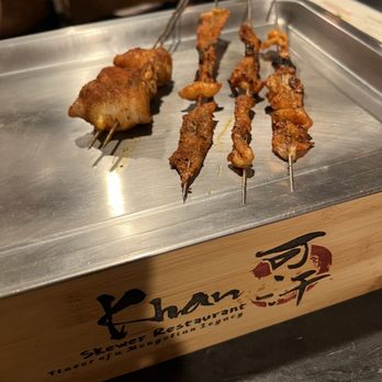Khan Skewer Restaurant - Pork belly wrap quail eggs ($4.99 a stick) and chicken skins (3 sticks) - Barbeque Near Me - Honolulu, Hawaii Khan Skewer Restaurant - Pork belly wrap quail eggs ($4.99 a stick) and chicken skins (3 sticks) - Barbeque Near Me - Honolulu, Hawaii