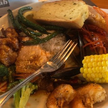 Juicy buffet - a plate of food on a table - Seafood Near Me - South Bend, Indiana