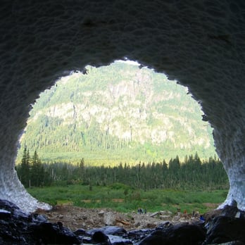 Big Four Ice Caves - From inside the western most cave, some of those (tiny) people are inside the edge of the cave - Parks Near Me - Granite Falls, Washington