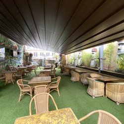 The Tiki Bar & Kitsch Inn - Outdoor tiki oasis