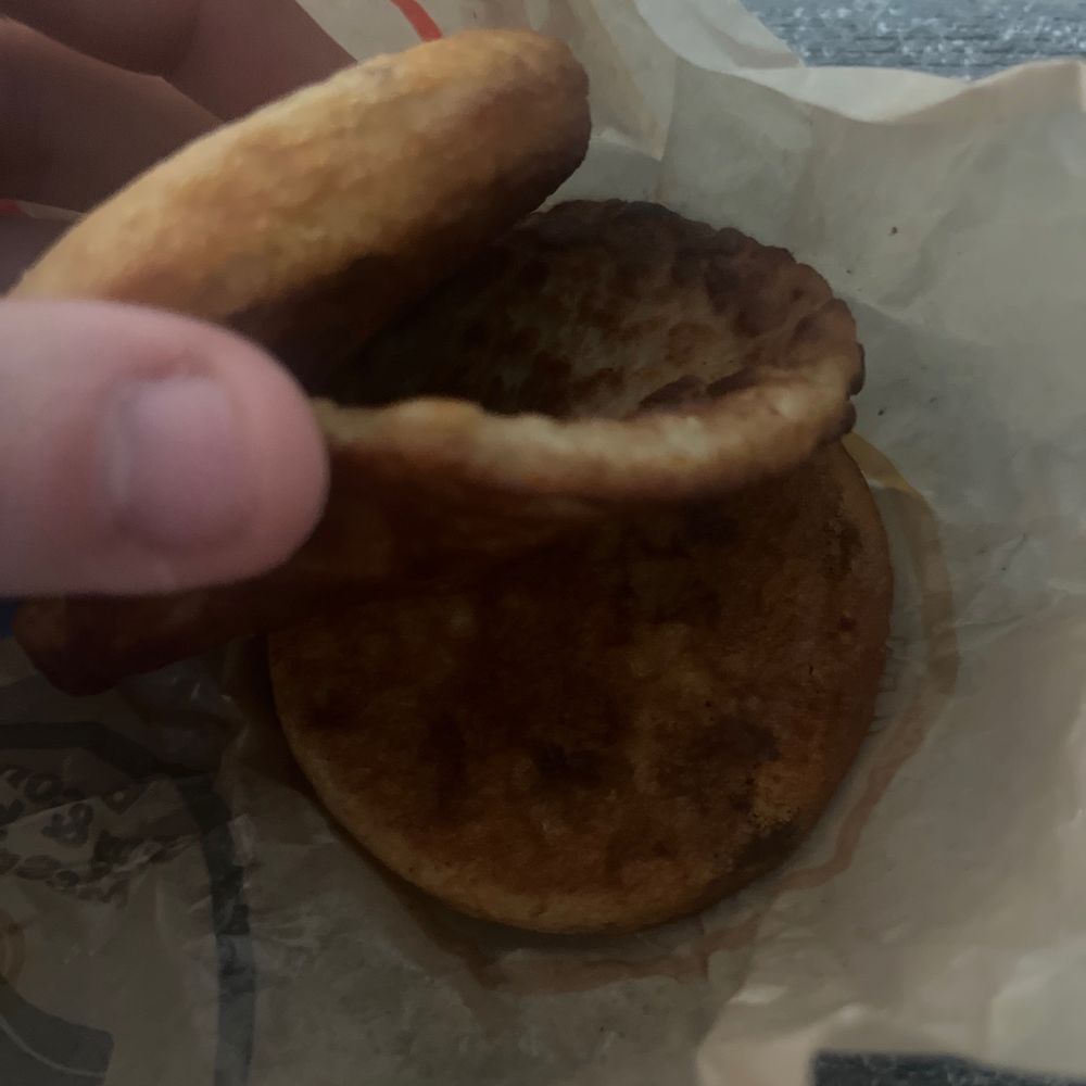 McDonalds - a hand holding a half eaten sandwich - Fast Food Near Me - Invermere, British Columbia McDonalds - a hand holding a half eaten sandwich - Fast Food Near Me - Invermere, British Columbia