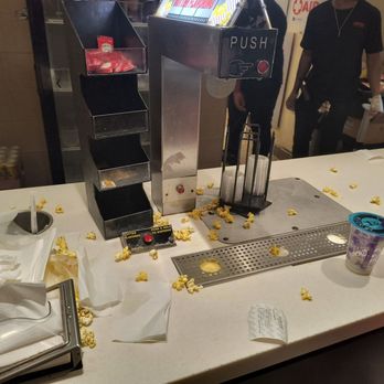AMC White Marsh 16 - This is where you get to butter your popcorn and empty condiments, but we watched the napkins get so neatly refilled - Cinema Near Me - Baltimore, Maryland