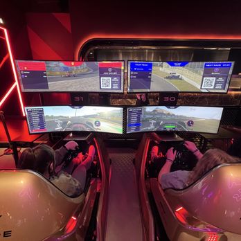 F1 Arcade - Top TV view is 3rd person, bottom TV view is 1st person from the driver's seat but can be adjusted if you want. - Arcades Near Me - Washington, DC, District of Columbia