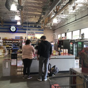 BevMo! - a man and a woman in a grocery store - Beer, Wine & Spirits Near Me - San Bruno, California