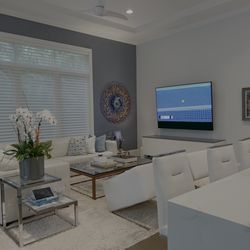 Stereo Types - Naples/Grey Oaks Home theater system with custom-built AV credenza, Sony TV, SONOS sound bar, neatly concealed into a custom sound bar case.