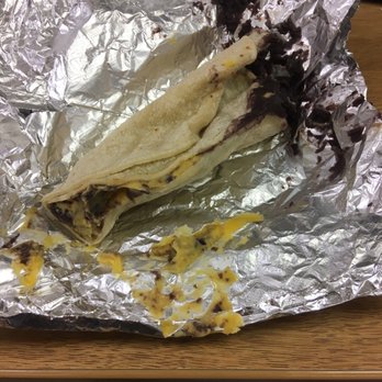 Loli's Cafe - Black beans and cheese spilling outside of the taco. - Mexican Near Me - San Marcos, Texas