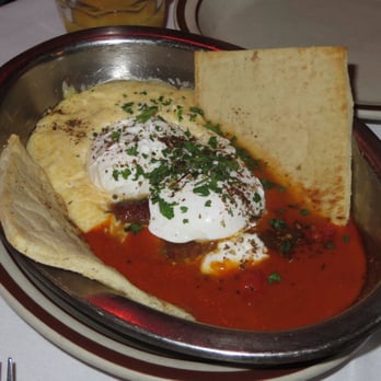 The Beehive - Eggs Shakshuka, poached eggs, North African style tomato sauce, polenta $14.50 with Moroccan sausage +$1.50 for $16 7/2014 - American Near Me - Boston, Massachusetts The Beehive - Eggs Shakshuka, poached eggs, North African style tomato sauce, polenta $14.50 with Moroccan sausage +$1.50 for $16 7/2014 - American Near Me - Boston, Massachusetts