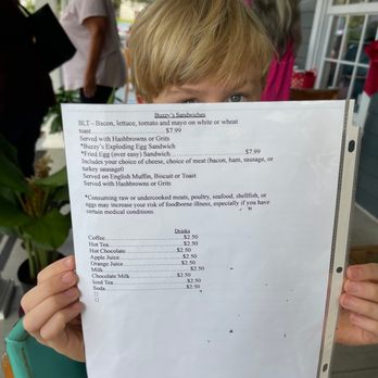 Buzzy's Breakfast Downtown - a child holding a menu - Breakfast & Brunch Near Me - Ocean Springs, Mississippi Buzzy's Breakfast Downtown - a child holding a menu - Breakfast & Brunch Near Me - Ocean Springs, Mississippi