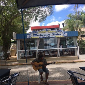 Marisqueira Sintra - Sidewalk tables are across the small street from the restaurant - Seafood Near Me - Florianópolis, South Carolina