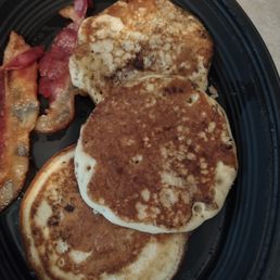 Black something on the pancakes and only 2 pieces of bacon instead of 3 as they advertise.