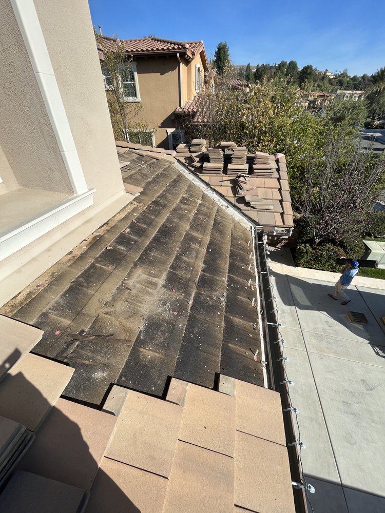 Slide of Steve’s Roofing Repair